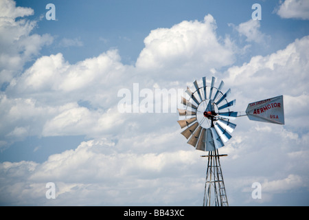 Desert windmill, water tank and horses on land near Hovemweep National Monument, Mesa Verde County, Utah Stock Photo