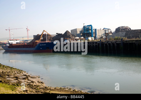 Scrap metal being loaded onto a bulk carrier ship Newhaven, East Sussex, England Stock Photo