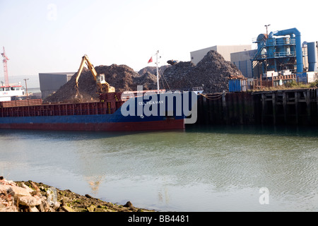 Scrap metal being loaded onto a bulk carrier ship Newhaven, East Sussex, England Stock Photo