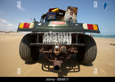 Back end of dune buggy on beach in Brazil with kiteboarding gear. Stock Photo