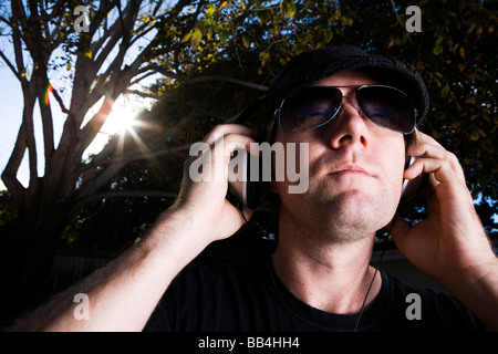 Guy listening to music, Carlsbad, California. Stock Photo