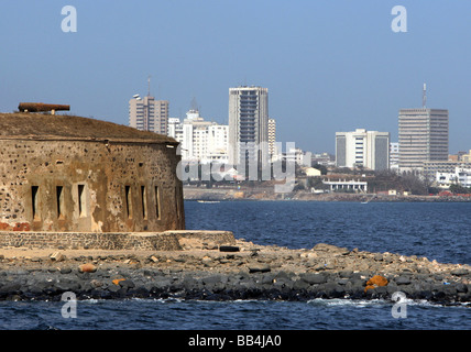 Senegal, Dakar: french colonial garrison on Goree Island (front) and the skyline of modern Dakar(background) Stock Photo