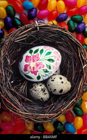 Easter egg with quail eggs in nest