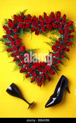 Red rose heart and wine glass with shoe Stock Photo