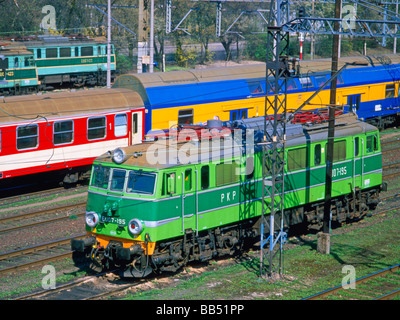 Poznan, Wielkopolska, Poland. Trains on track by main station. Brightly coloured carriages Stock Photo