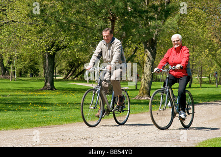 senior couple on bicycles Stock Photo