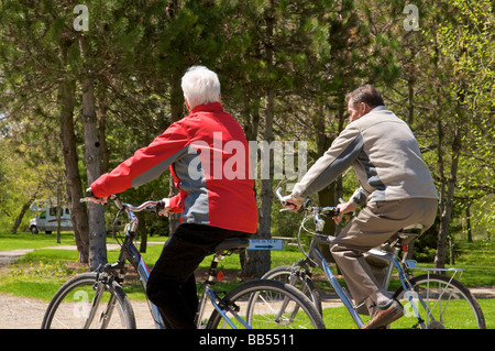senior couple on bicycles Stock Photo