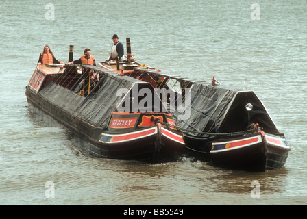 Coal carrying Josher narrowboats on the River Thames at Surrey Docks London England UK Stock Photo