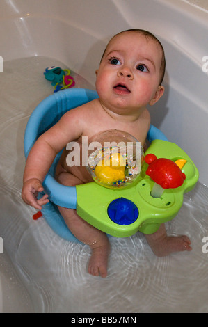 6 month old baby in the bath Stock Photo