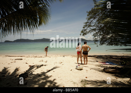 tourists at the beach on Pulau Mamutik Island in Tunku Abdul Rahman National Park near Kota Kinabalu Sabah Borneo Malaysia Stock Photo