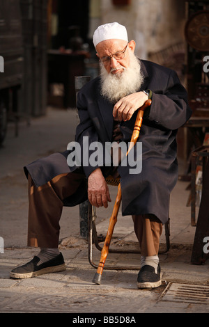 Old man sleeping on Straight Street, Damascus Stock Photo