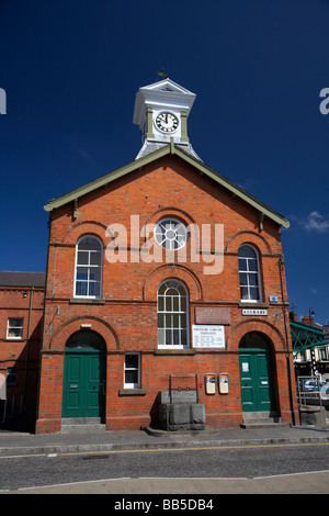 dromore town hall with its clock tower and ancient stocks county down northern ireland uk Stock Photo