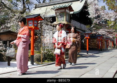 Women dressed as Geisha wearing Kimono at a temple in Kyoto, Japan. Stock Photo