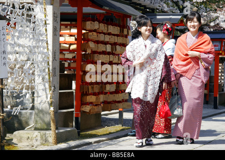 Women dressed as Geisha wearing Kimono at a temple in Kyoto, Japan. Stock Photo