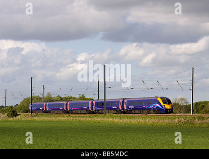 A class 180 Coradia 1000 diesel multiple unit number 180113 working a First Hull Trains service at Langford on the East Coast main Line. Stock Photo