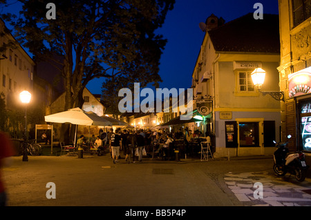 Tkalciceva street lined with cafes and restaurants with people sitting at tables outside on pavement in Old city of Zagreb Croatia Stock Photo