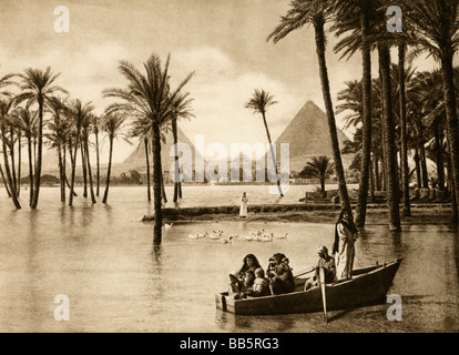 geography / travel, Egypt, Nile at Giza during the inundation, pyramids in the background, 1930s, , Stock Photo
