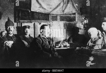 Hitler, Adolf, 20.4.1889 - 30.4.1945, German politician (NSDAP), Fuehrer and Reich Chancellor since 1933, during First World War, WWI, with comrades in a shelter on the Western Front 1914/1915, (left, with Pickelhaube), group picture, Stock Photo