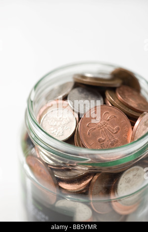 Loose change: a jam jar full of British coins. Picture by Jim Holden. Stock Photo