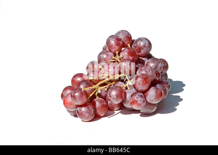 Cluster of red grapes on white background Stock Photo