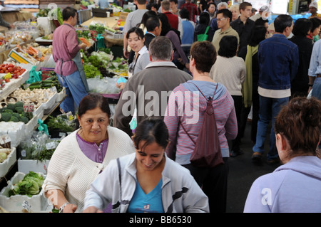 Multiracial crowd inside Queen Victoria Market Melbourne Stock Photo