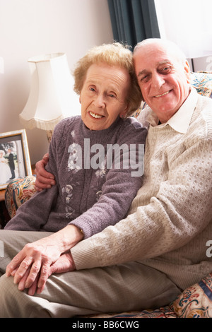 Loving Senior Couple Relaxing At Home Stock Photo