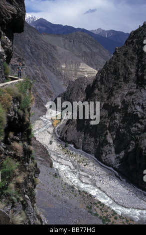 traveller trekking irrigation water channel Kalash valley Chitral Khyber Pakhtunkhwa (was North West Frontier Province) Pakistan Stock Photo