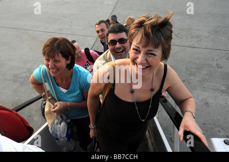 Holiday makers boarding airplane at Stanstead Airport Stock Photo