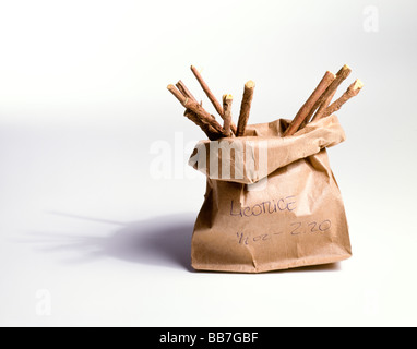 A paper bag of loose herbs on a white background with a shdow Stock Photo