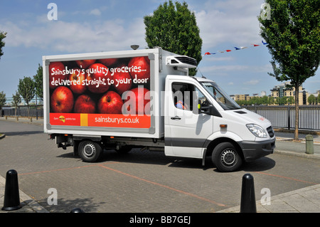 Sainsburys supermarket delivery van parking up to make home delivery of food shopping Stock Photo