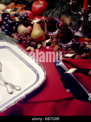 A holiday feast table setting with a Christmas theme Stock Photo