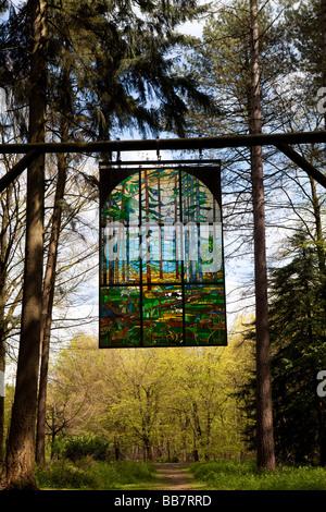 UK Gloucestershire Forest of Dean Sculpture Park Cathedral by Kevin Atherton 1986 suspended stained glass panel Stock Photo