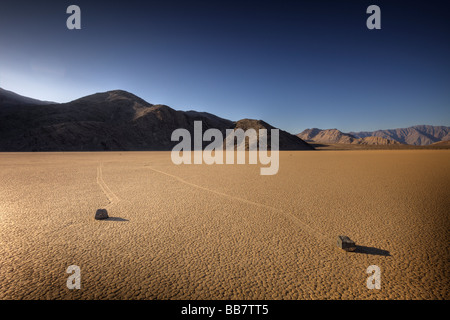Moving rocks on salt flats at The Racetrack in Death Valley National Park in California USA Stock Photo