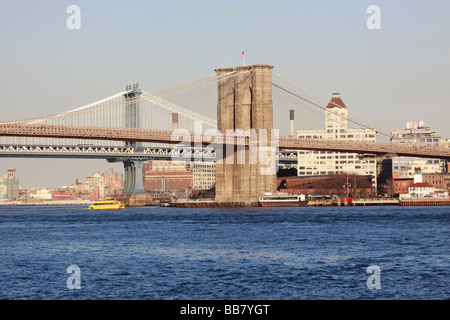 The Brooklyn and Manhattan Bridges over New York City's East River, looking northeast towards Brooklyn from South St Seaport