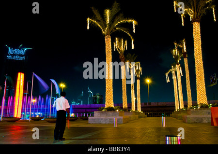 Man working at the carpark in front of the biggest shopping mall worldwide in Dubai, United Arab Emirates, Near East Stock Photo