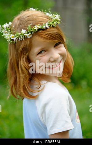 Young girl wearing a floral wreath in her hair Stock Photo
