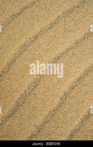 Patterns in the sand created by titanium sand on the South African Coastline. St Lucia, Kwazulu Natal Province, South Africa Stock Photo