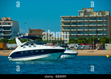 Powerboats anchoring in front of houses at Palamos Catalonia Spain Stock Photo