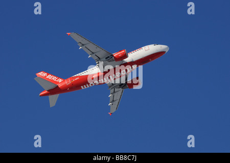 Commercial aircraft, Air Berlin, Airbus A319, climbing against a steel-blue sky, perspective from diagonally below, airberlin.c Stock Photo