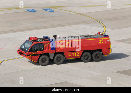 A fire truck of the airport fire brigade on the airfield at the airport ...