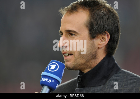 Former German international player as a football expert, with a microphone Stock Photo