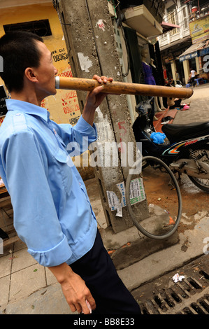 Vietnamese man smoking tobacco with traditional bamboo pipe, Old ...