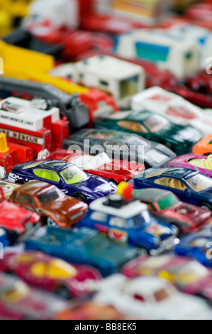 Old toy cars for sale on a market stall Stock Photo