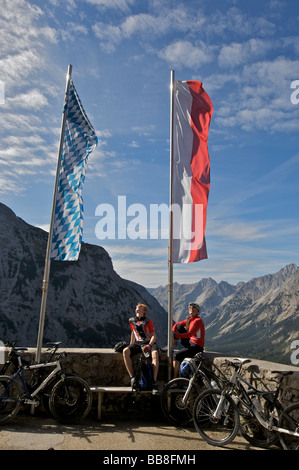 Mountainbike riders, male and female, taking a break at Karwendelhaus, alpine club house, Scharnitz, Tyrol, Austria, Europe Stock Photo