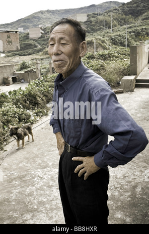 China, Zhoushan Prefecture, Shengsi Islands. Sijiao Island, fishing village, local man. Stock Photo