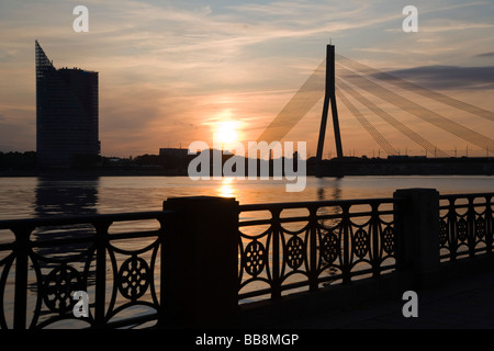 Cable bridge, Vansu tilts over Daugava and Saules Akmens building, at night, Riga, Latvia, Baltic region Stock Photo