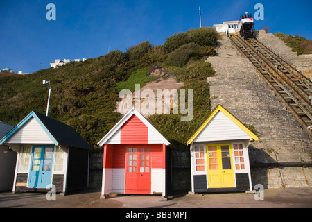 Beach huts and the car of the West Cliff Lift, funicular railway, Bournemouth, Dorset, England, United Kingdom Stock Photo