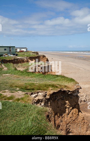 Holiday homes at a  caravan park in danger from North Sea coastal erosion on the cliffs of East Coast of England at Easington UK Stock Photo