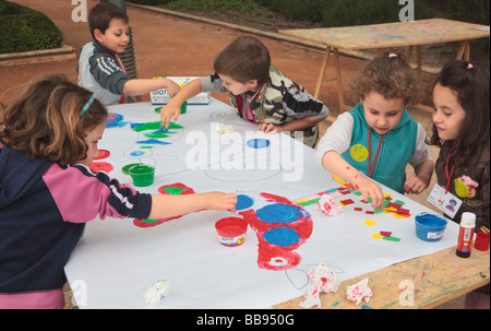 Primary school children enjoying an outdoor art class in the grounds of Huerta de San Vicente, Granada, Spain Stock Photo