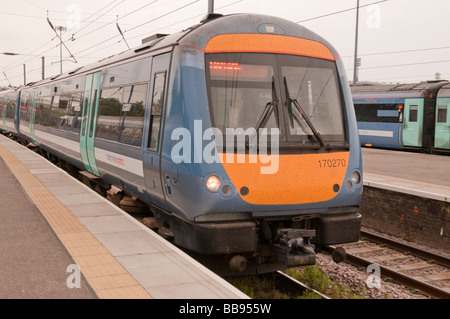 National Express DMU  type 170 turbostar arrives  at Norwich station with HST carriages in the background Stock Photo